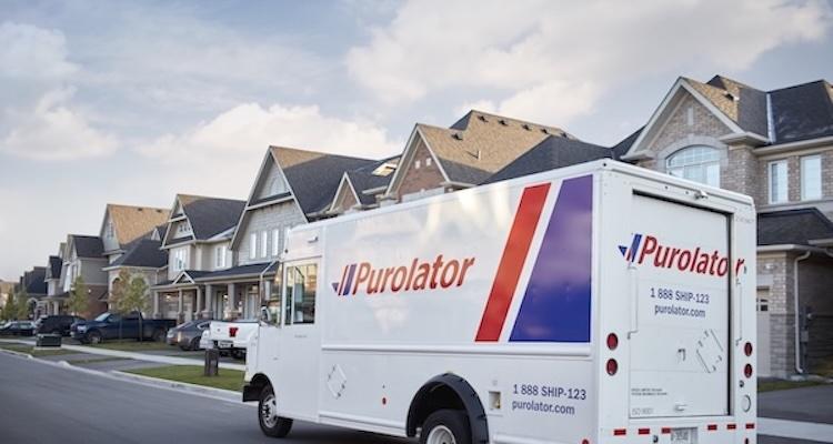 Purolator van driving through a neighborhood